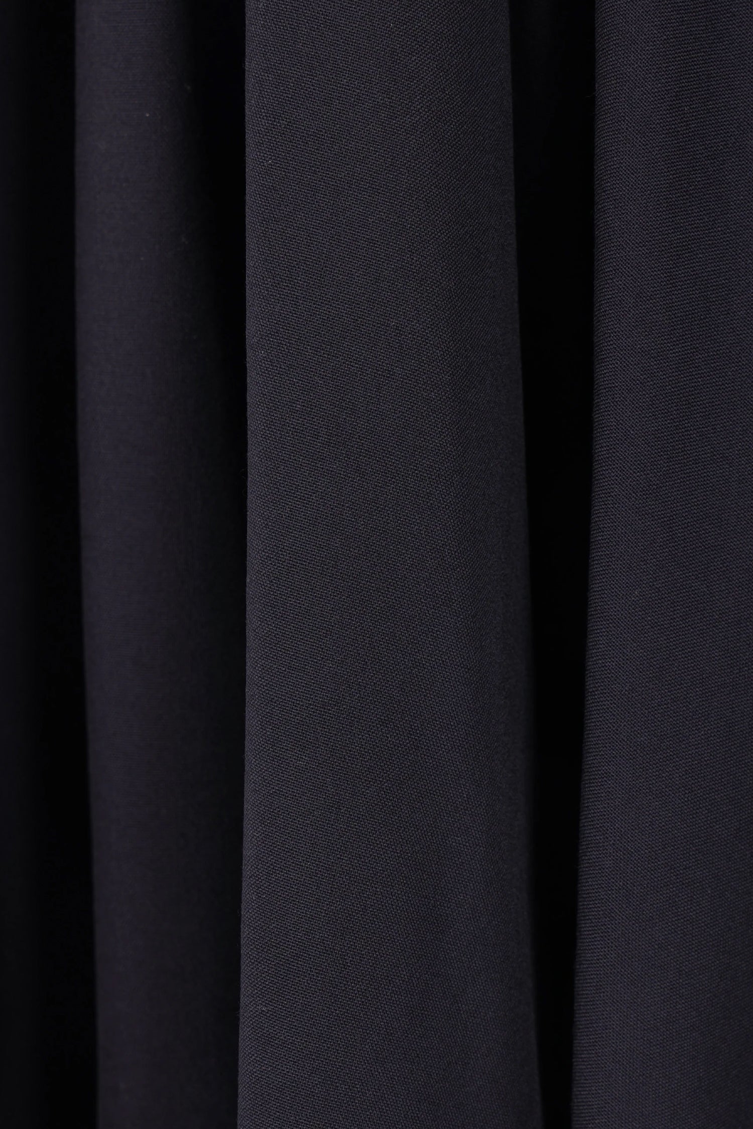 ASYMMETRIC WOOL SKORT IN NAVY, FW25