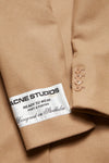 SINGLE-BREASTED WOOL COAT IN CAMEL BEIGE, SS24