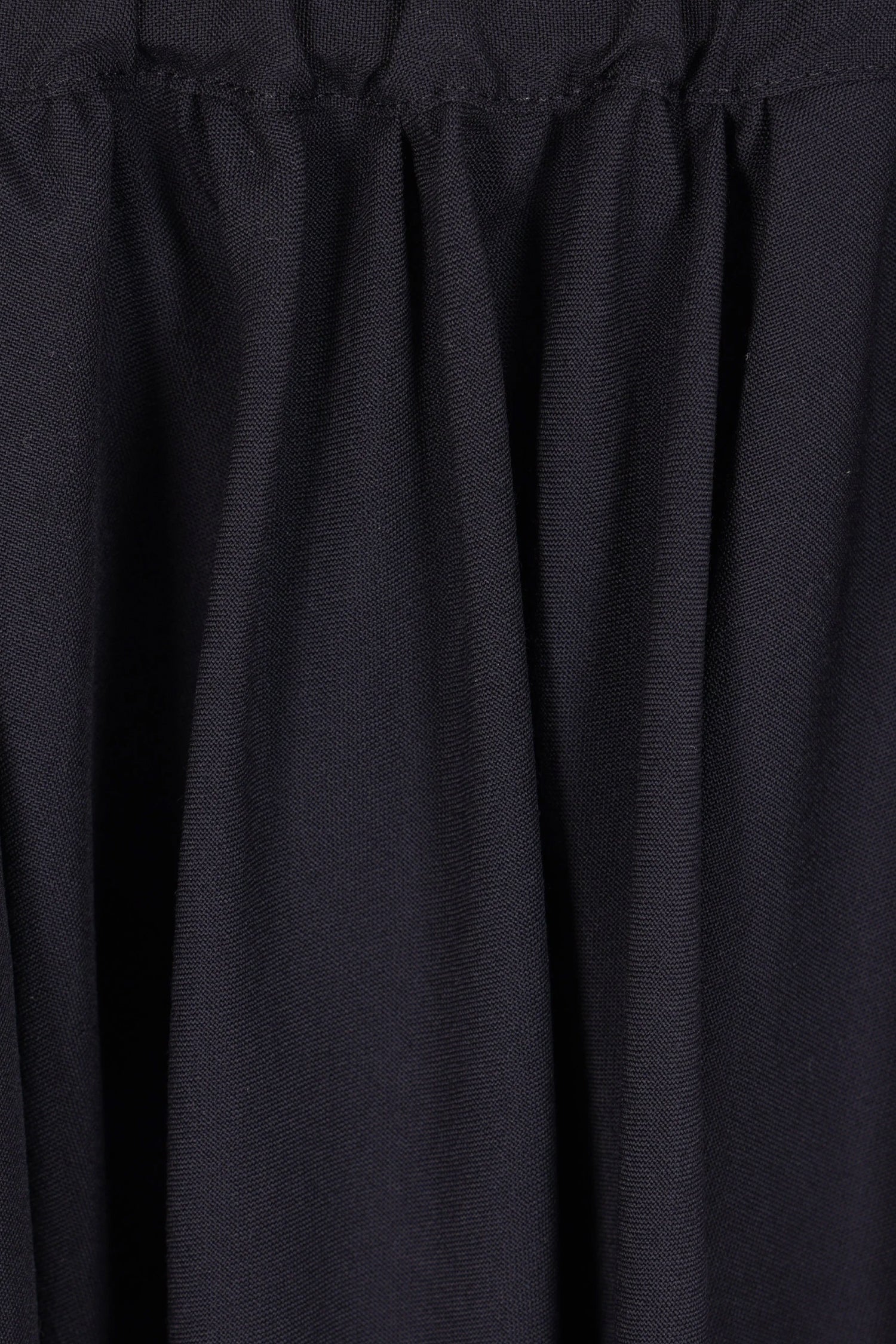 ASYMMETRIC WOOL SKORT IN NAVY, FW25