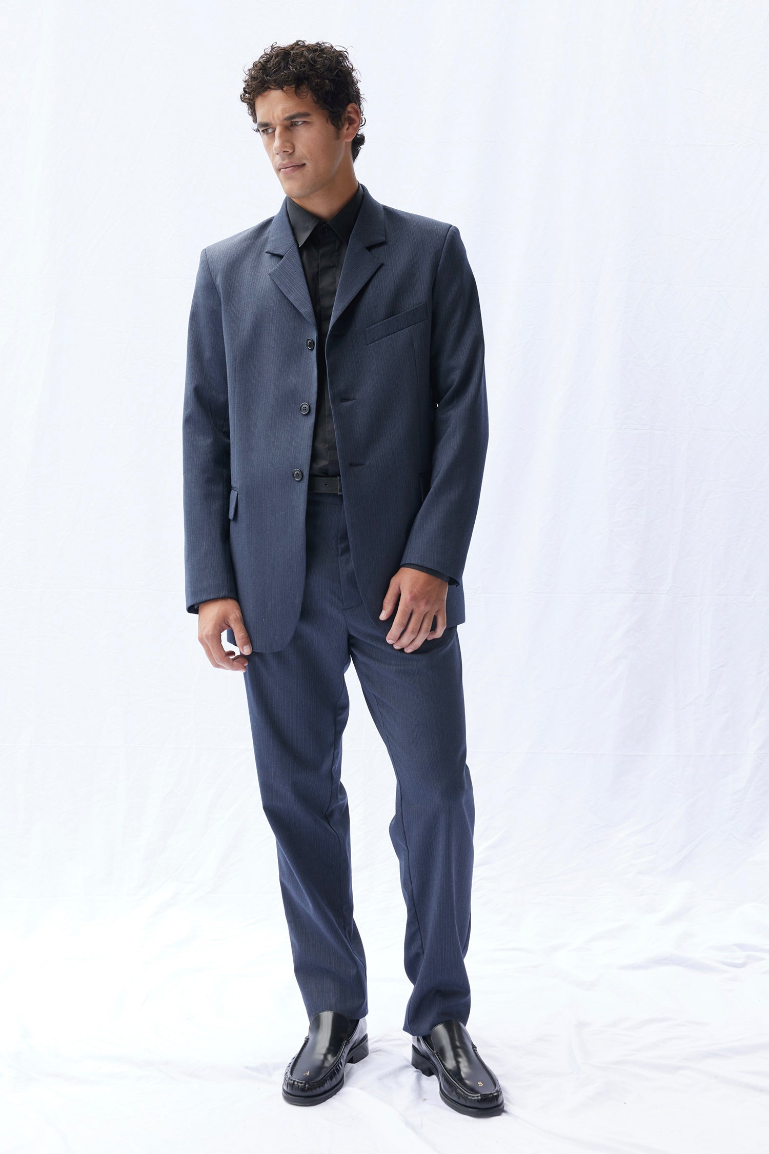 THE AUTEUR IN PINSTRIPE, W25