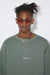 CREWNECK IN CEDAR GREEN, SS23
